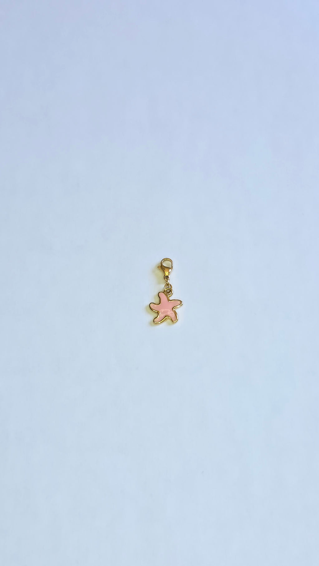 Charm Étoile de Mer doré et rose en acier inoxydable